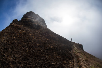 Hiker on traversing ridgeline in Drakensberg South Africa 