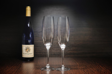 Glasses of champagne and bottle for celebration and event.