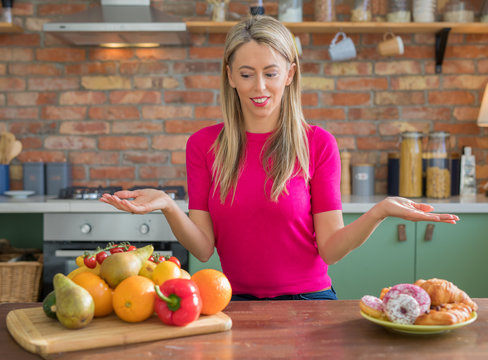 Woman offering to choose between healthy and unhealthy diet
