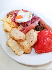 classical english breakfast with egg and ham