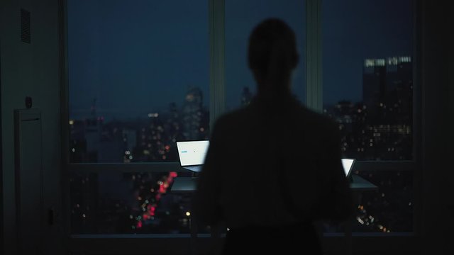 Female trader in formal wear resting in comfortable orthopedic chair during overtime work in corporate office og big enterprise, modern digital technology with copy space area for web information
