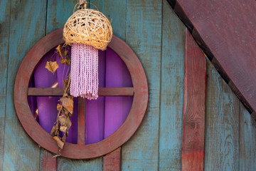 Wooden house with pink walls in the jungle
