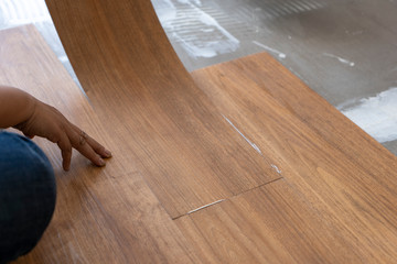 luxury vinyl floor tile collection : step of Vinyl installation by laying vinyl sheet tiles on...