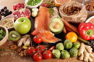 health food assortment with fruit, vegetable, fish, cereal