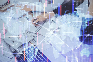 International business hologram over hands taking notes background. Concept of success. Multi exposure