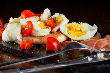  boiled egg with parma ham and cherry tomatoes
