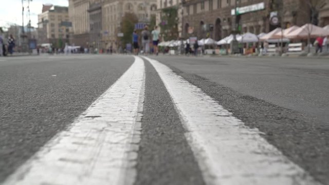 Double line road marking city street camera movement slow motion