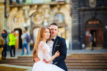 Fototapeta premium Happy bride and groom celebrating wedding day