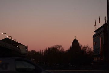 Sunset cityscape with church in skyline in Kreuzberg Berlin Germany