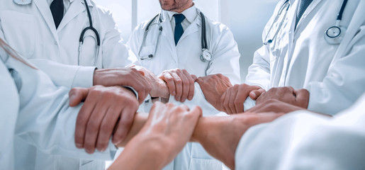 close up.a group of doctors standing in a circle