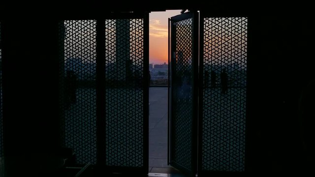 Sunset behind a beautiful wooden closing door