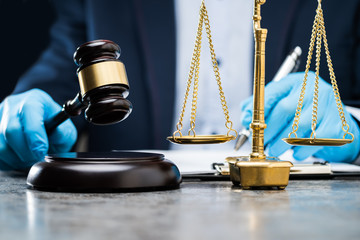 Judge Writing On Paper