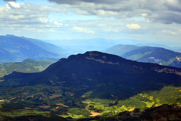 Naklejka premium Big mountain in the shadows of a could, during a beautiful summer day in the french Alps. 