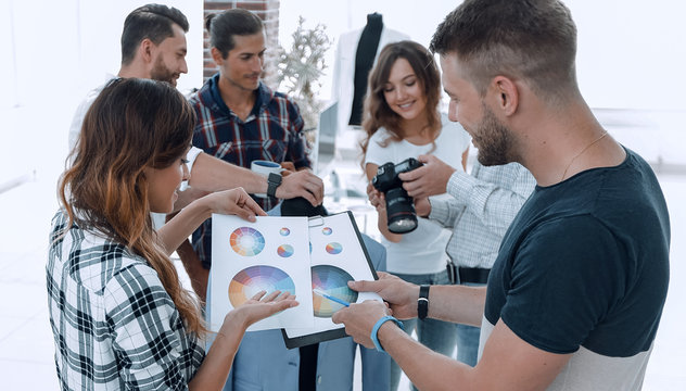 fashion designers discussing color palette in the Studio.