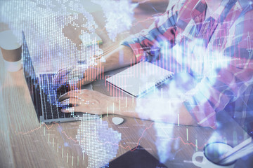 Multi exposure of forex graph with man working on computer on background. Concept of market analysis.
