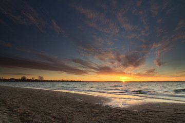 Naklejka na ściany i meble Sunset on the beach - Baltic Sea Poland. 