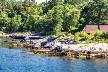 Fototapeta na wymiar Typical scandinavian rocky shore in Norway
