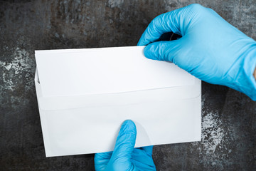 Person Removing Paper From Envelope