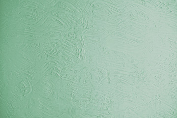 Green wall background with embossed abstract pattern with color gradient