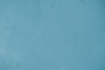 Pastel blue wall background with embossed abstract pattern
