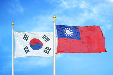 South Korea and Taiwan two flags on flagpoles and blue cloudy sky