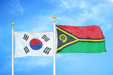 South Korea and Vanuatu two flags on flagpoles and blue cloudy sky