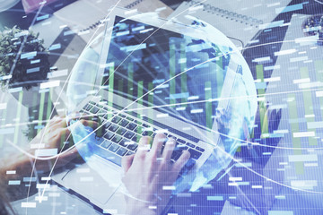 Double exposure of businessman working on laptop on background. International business hologram in front. Concept of success.