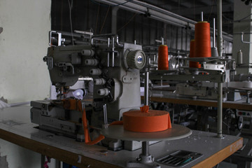 sewing machine in a large sewing shop, factory