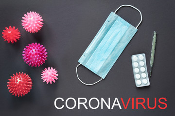Concept of the coronavirus epidemic on a gray background with the image of the virus.