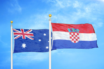 Australia and Croatia two flags on flagpoles and blue cloudy sky
