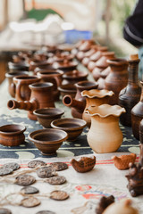 Handmade clay brown pots with blurry background