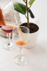 White background, wine glasses and black, strong, morning, fresh coffee in glass container for alternative method preparation.