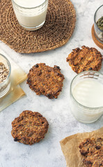 Oatmeal raisin on paper on a light background with milk