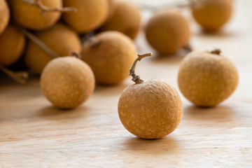Close up of longan on wooden background