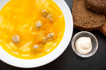 Meatball soup. Top view, copy space. Flavored, delicious soup on your table