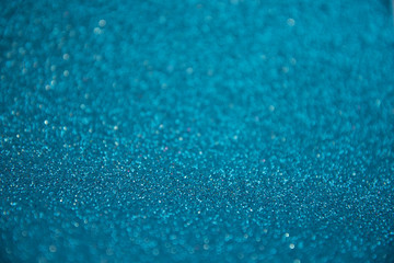 Brilliant blue background for Christmas cards. Sequins