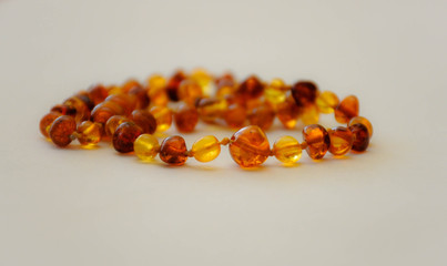 amber necklace on white background