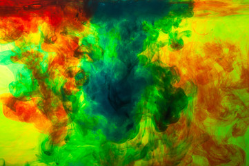 Fototapeta na wymiar Colored ink in water, abstract background