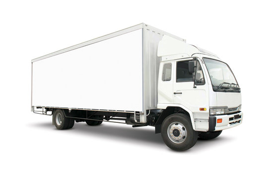 White heavy truck with cargo container