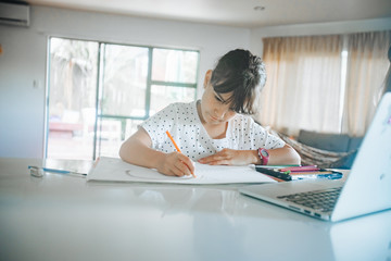 young caucasian girl drawing at home, on-line art calss, home schooling, stay home education