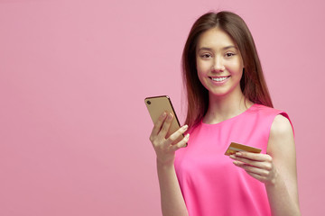Cute blond girl receive cool cash back or banking, online shopping offer after using new credit card with student offer.