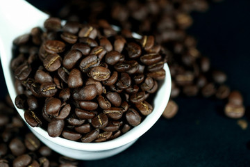 Coffee beans in a white cup , close up , top view