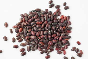 Dark red beans scattered. Close up food photo.