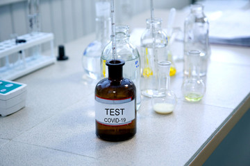 covid-19 virus test. glass jar with test samples, laboratory conditions.