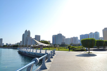 View of Abu Dhabi Cornish during the day tome with beautiful blue sky and blue sea. Luxury...