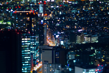 A night miniature highway at the urban city in Tokyo high angle tiltshit