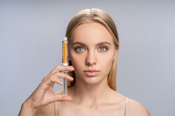 Close up of cute girl that doing facial treatment