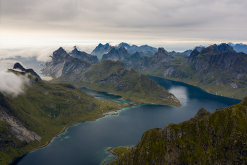 Fototapeta premium Coastal lake and mountains seen from above at Moskenes, Norway