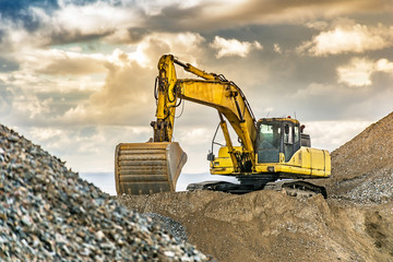 Excavator on the road construction works. Machinery needed for construction © Enrique del Barrio