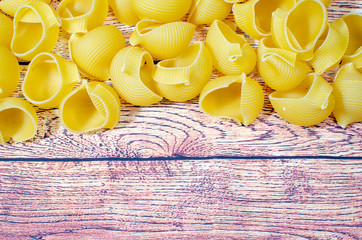 pasta scattered on the table. Top view, copy space.